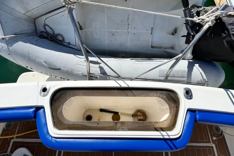 Slide: The Image of 1990 Mediterranean 38 Sport Fisher boat with inflatable dinghy and live bait well. - 13