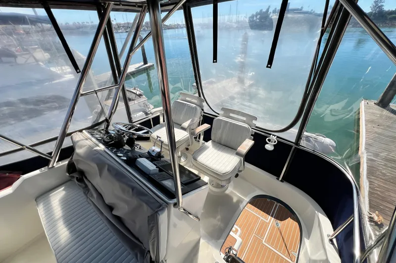 Slide: The Image of Interior view of 1990 Mediterranean 38 Sport Fisher boat with helm and seating. - 22