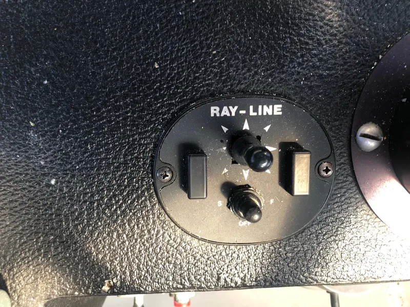 Slide: The Image of Control panel of a 1990 Mediterranean 38 Sport Fisher boat with Ray-Line switches. - 27