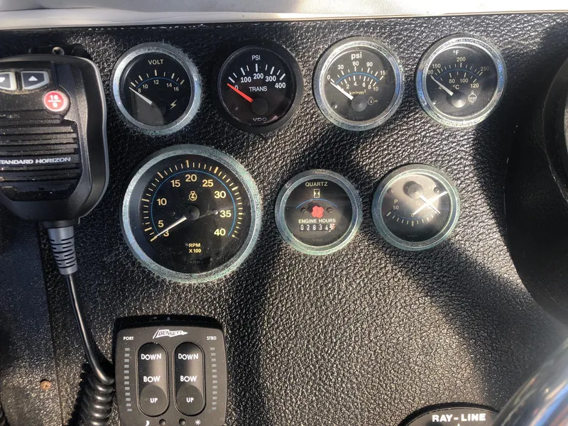 Slide: The Image of Dashboard of a 1990 Mediterranean 38 Sport Fisher with gauges and radio controls. - 29