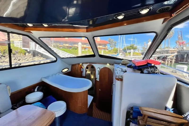 Slide: The Image of Interior of 1990 Mediterranean 38 Sport Fisher boat with seating and windows. - 35