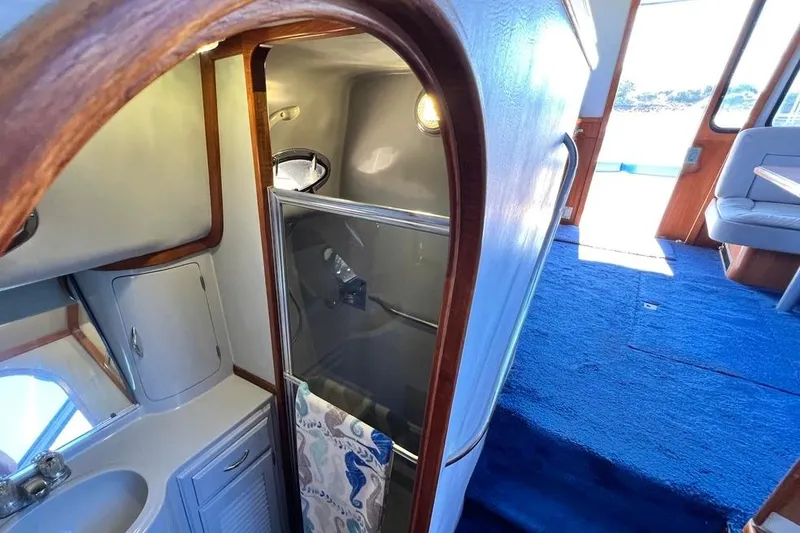 Slide: The Image of Interior of 1990 Mediterranean 38 Sport Fisher yacht with bathroom and seating area. - 41