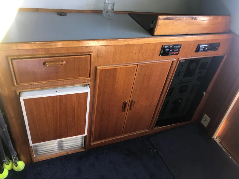 Slide: The Image of 1990 Mediterranean 38 Sport Fisher interior with wooden cabinetry and control panel. - 50