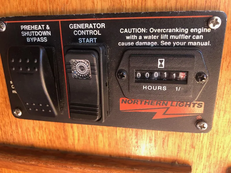 Slide: The Image of Control panel of a 1990 Mediterranean 38 Sport Fisher with generator and hour meter. - 51