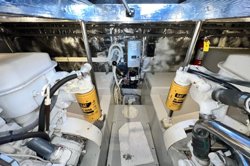 Slide: The Image of Engine room of 1990 Mediterranean 38 Sport Fisher with CAT filters and mechanical components. - 61