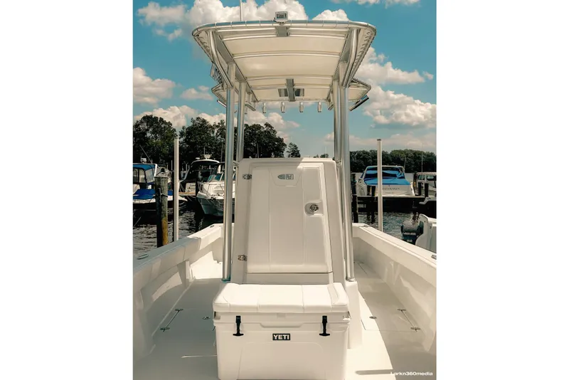 Slide: The Image of 2025 LTB 25 Demo Boat with Key-West soft top T-top and YETI cooler seat. - 3