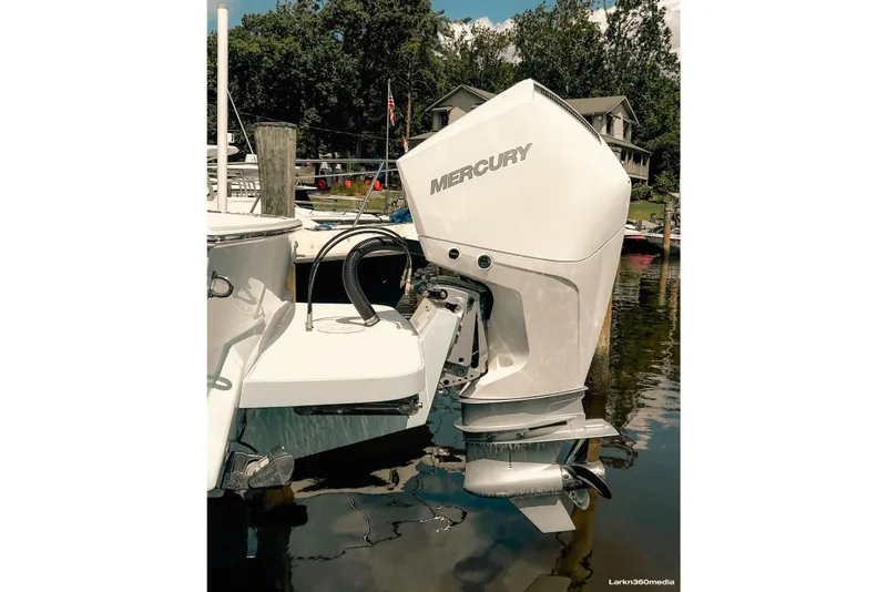Slide: The Image of Miami Welding outboard bracket with a single Mercury 300 V8, Seakeeper Ride trim tabs, and stainless swim ladder. - 8