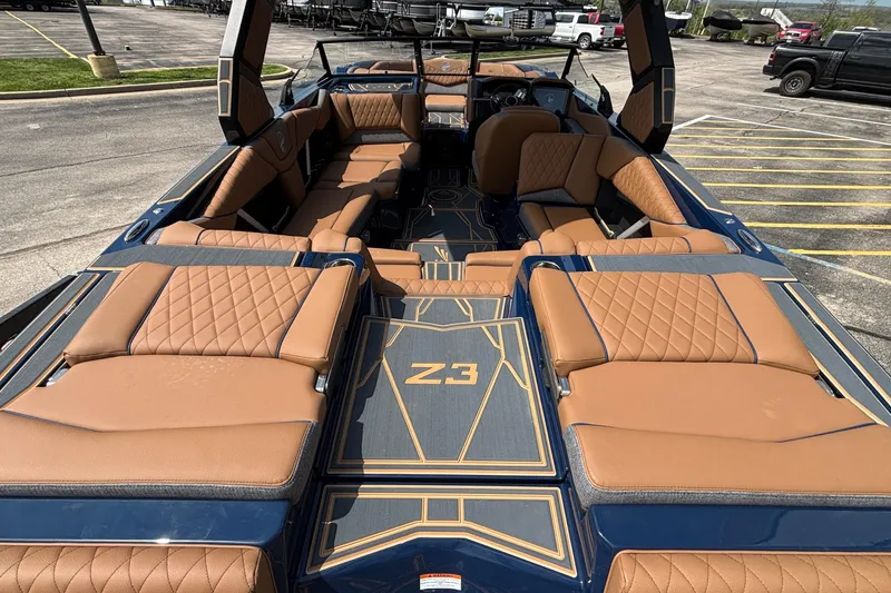 Slide: The Image of 2026 Tigé Z3 boat interior with luxurious tan leather seating and modern design. - 12