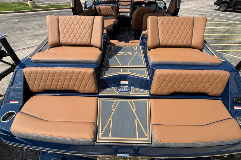 Slide: The Image of 2026 Tigé Z3 boat with luxurious tan seating and stylish deck design. - 13