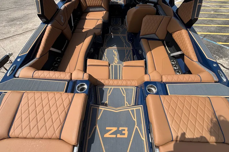 Slide: The Image of Luxurious interior of 2026 Tigé Z3 boat with tan leather seating and stylish design. - 15