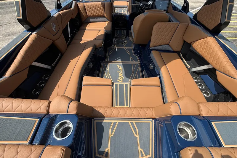 Slide: The Image of Luxurious interior of 2026 Tigé Z3 boat with tan leather seating and stylish design. - 16