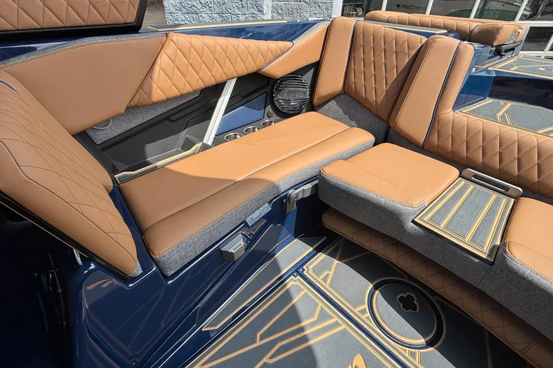Slide: The Image of 2026 Tigé Z3 boat interior with luxurious tan and gray seating, diamond stitching. - 19