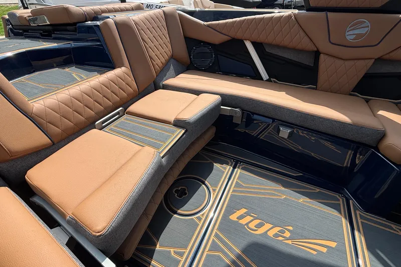 Slide: The Image of Luxurious interior of 2026 Tigé Z3 boat with tan leather seating and stylish flooring. - 21