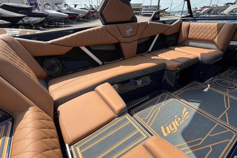 Slide: The Image of 2026 Tigé Z3 boat interior with luxurious tan seating and modern design elements. - 22