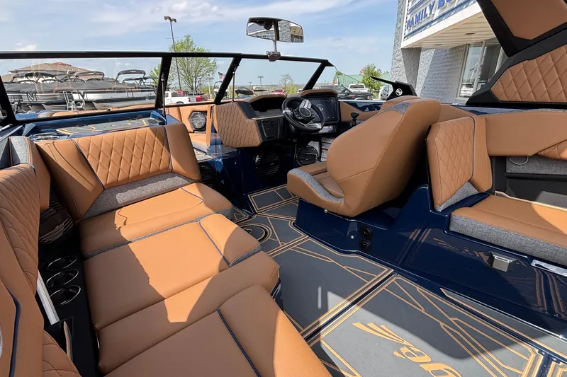 Slide: The Image of 2026 Tigé Z3 boat interior with luxurious tan seating and modern dashboard design. - 23