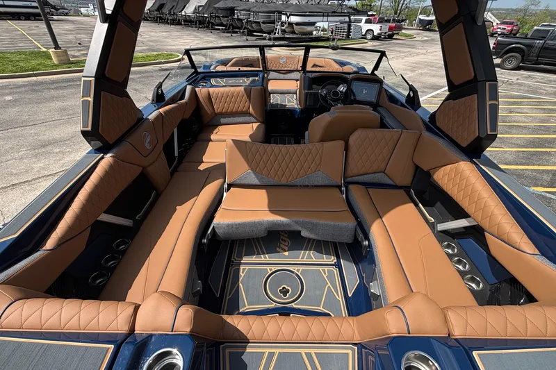 Slide: The Image of Luxurious interior of 2026 Tigé Z3 boat with tan leather seating and modern dashboard. - 26