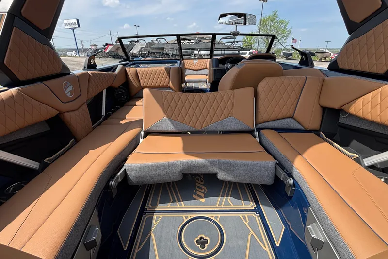 Slide: The Image of Luxurious interior of 2026 Tigé Z3 boat with tan and gray seating. - 27