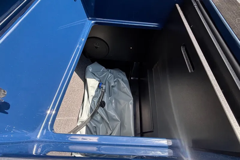 Slide: The Image of 2026 Tigé Z3 boat storage compartment with blue exterior and interior equipment. - 30