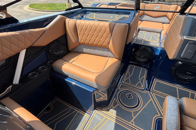 Slide: The Image of Luxurious interior of 2026 Tigé Z3 boat with tan and gray seating. - 39