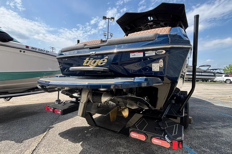 Slide: The Image of 2026 Tigé Z3 boat rear view, showcasing sleek design and powerful engine components. - 4