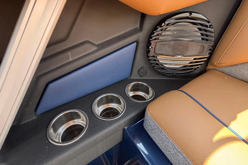 Slide: The Image of 2026 Tigé Z3 interior with speaker, cup holders, and brown seating. - 43