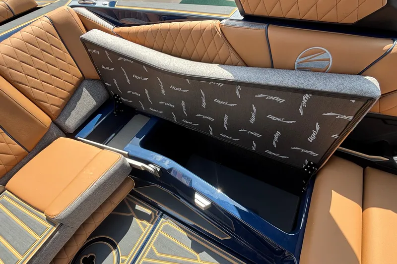 Slide: The Image of 2026 Tigé Z3 boat interior with open storage compartment and luxurious seating. - 44