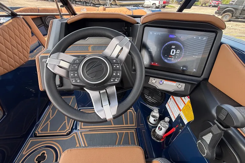 Slide: The Image of 2026 Tigé Z3 boat dashboard with steering wheel and touchscreen display. - 48