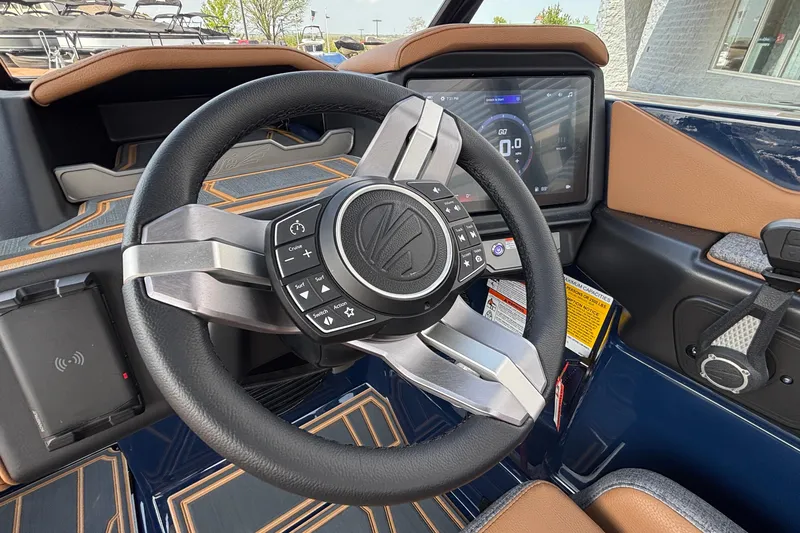 Slide: The Image of 2026 Tigé Z3 boat interior with modern steering wheel and digital dashboard display. - 49