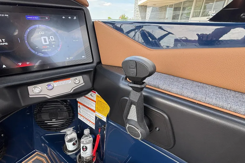 Slide: The Image of 2026 Tigé Z3 boat dashboard with touchscreen display and control lever. - 50