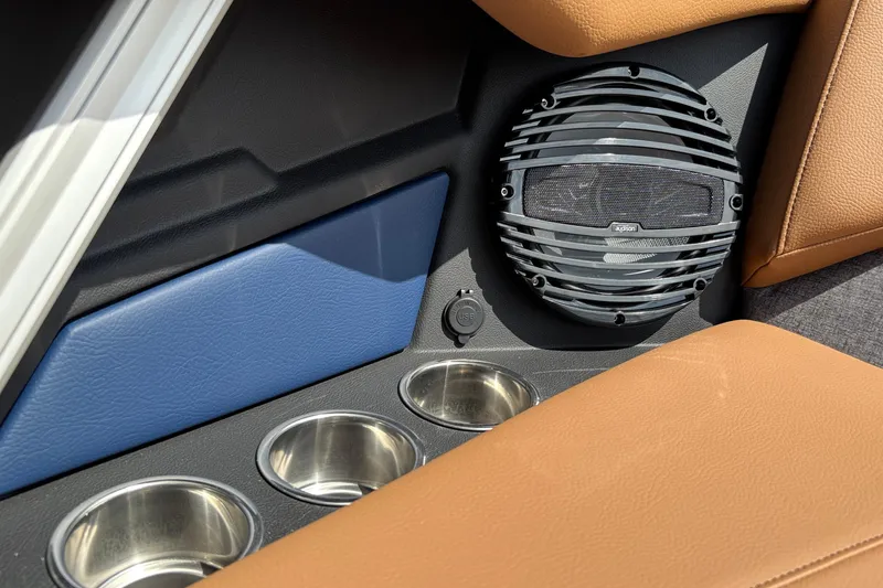 Slide: The Image of Interior of 2026 Tigé Z3 boat featuring speaker, cup holders, and USB port. - 52
