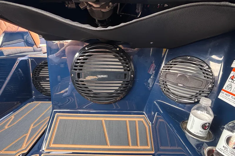 Slide: The Image of Interior of 2026 Tigé Z3 boat featuring Audison speakers and cup holders. - 53