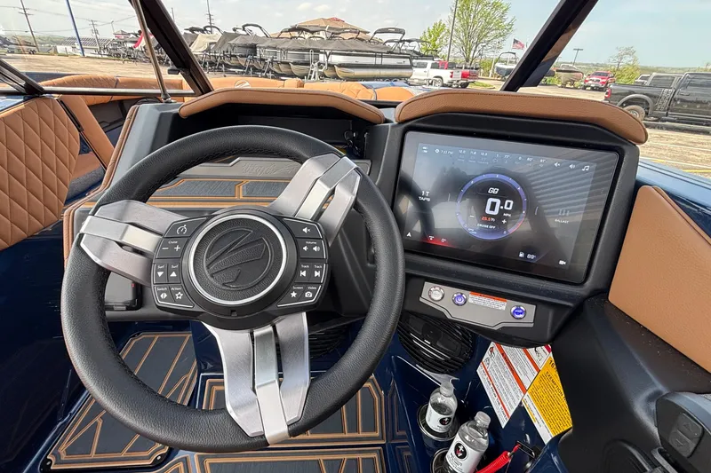 Slide: The Image of 2026 Tigé Z3 boat dashboard with steering wheel and touchscreen display. - 54