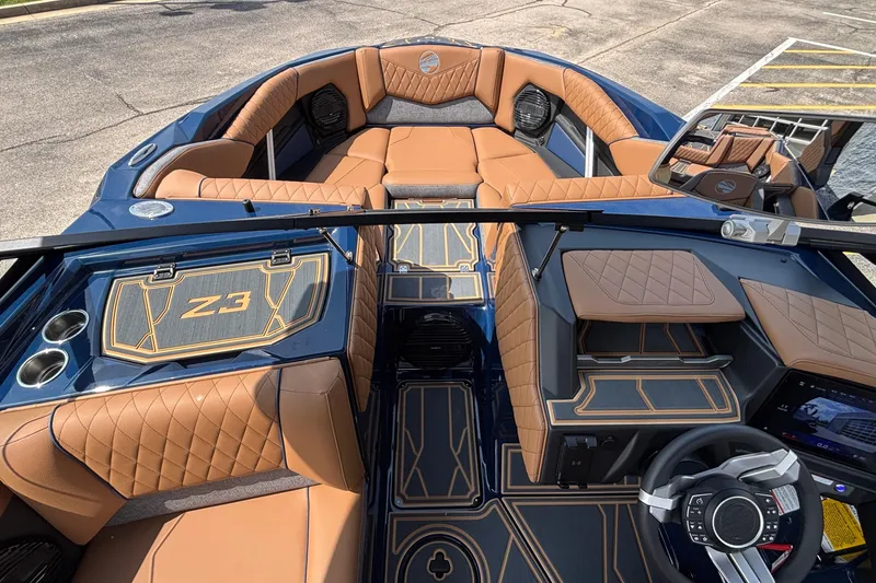 Slide: The Image of 2026 Tigé Z3 boat interior with luxurious tan seating and modern dashboard design. - 58