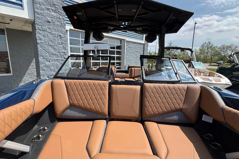 Slide: The Image of 2026 Tigé Z3 boat interior with tan diamond-stitched seats and modern design. - 65