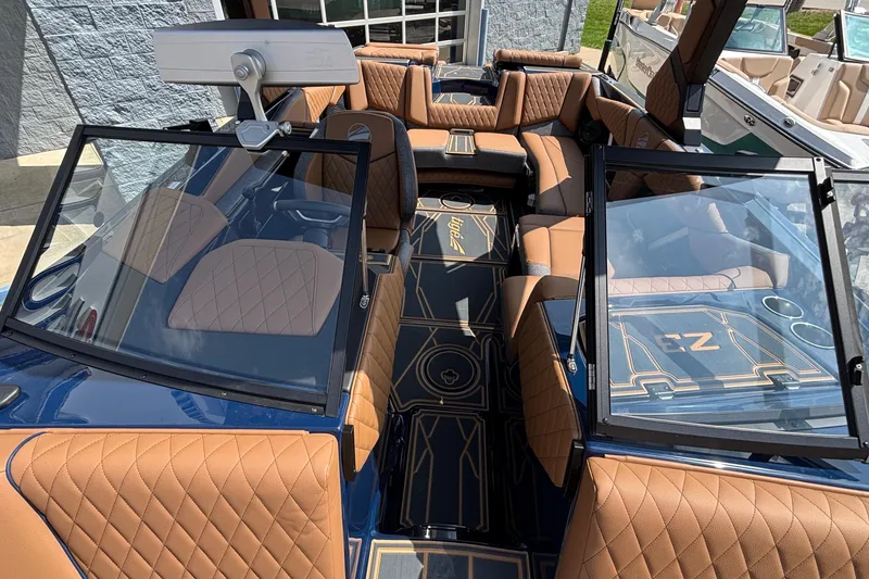 Slide: The Image of 2026 Tigé Z3 boat interior with luxurious tan leather seating and modern design. - 69