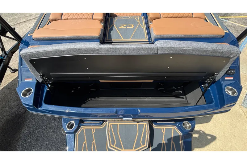 Slide: The Image of 2026 Tigé Z3 boat interior with open storage compartment and cushioned seating. - 70