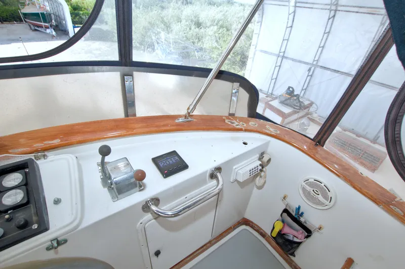 Slide: The Image of Cockpit of 1999 Monk 36 Trawler with controls and navigation equipment. - 26