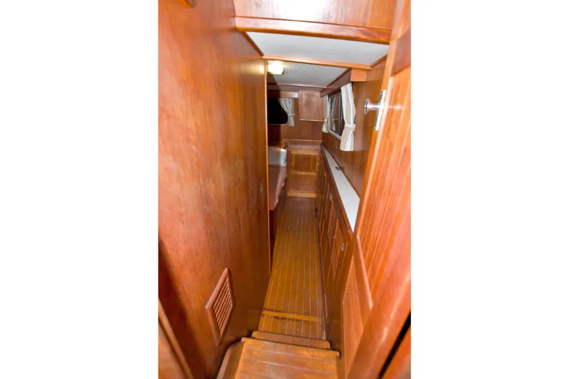 Slide: The Image of Interior of 1999 Monk 36 Trawler with wooden paneling and cabinetry. - 45