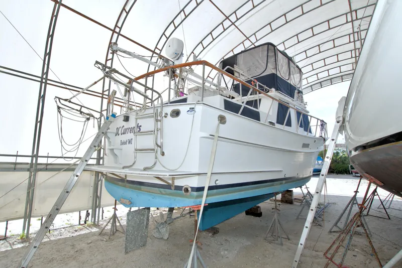 Slide: The Image of 1999 Monk 36 Trawler in dry dock under a protective canopy. - 6