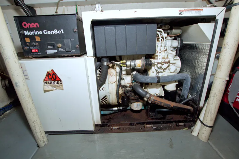 Slide: The Image of Onan Marine GenSet in 1999 Monk 36 Trawler engine room with CO warning label. - 62