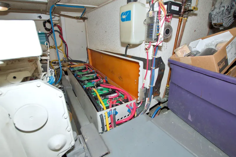 Slide: The Image of Engine room of 1999 Monk 36 Trawler with batteries and wiring. - 65