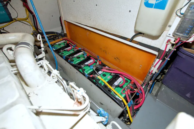 Slide: The Image of Battery compartment of a 1999 Monk 36 Trawler with wiring and components. - 66