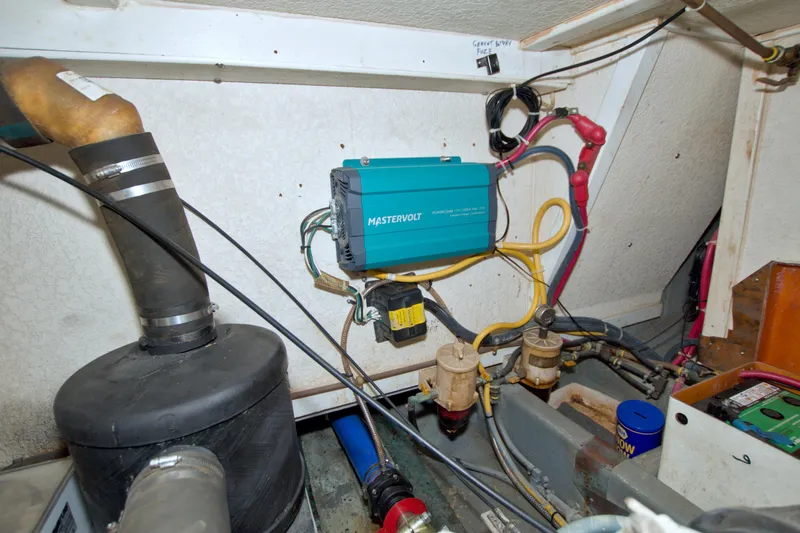 Slide: The Image of Engine room of a 1999 Monk 36 Trawler with electrical components and wiring. - 67