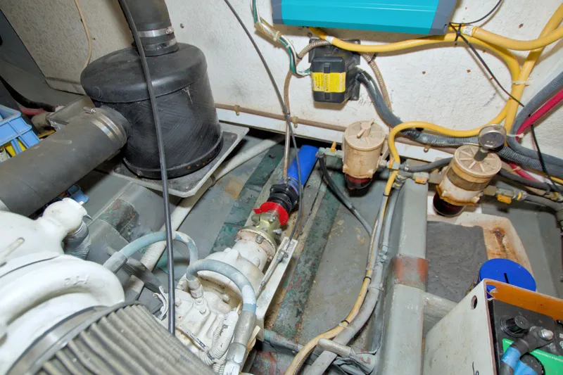 Slide: The Image of Engine room of a 1999 Monk 36 Trawler with visible mechanical components. - 68