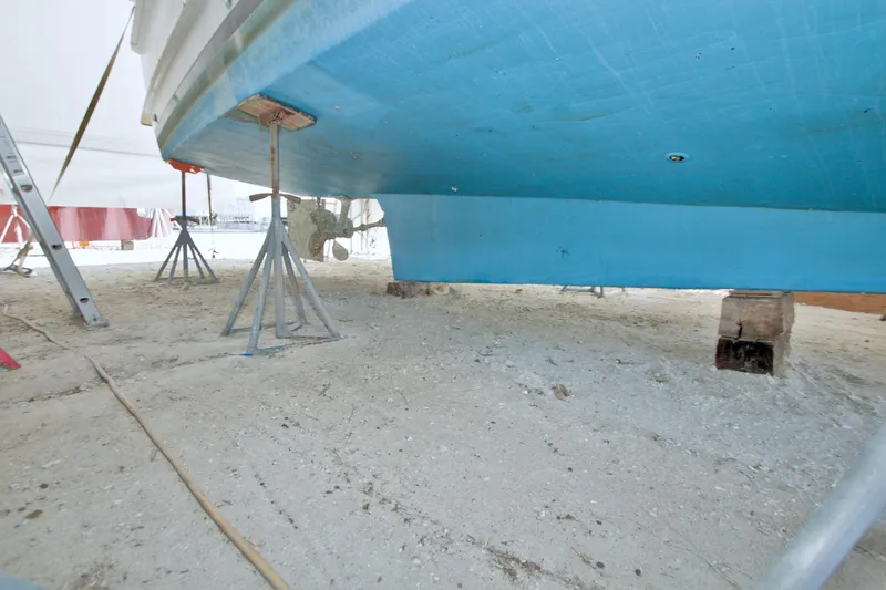 Slide: The Image of 1999 Monk 36 Trawler on stands, hull view, in dry dock. - 72