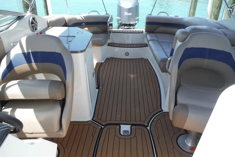 Slide: The Image of 2018 Hurricane SunDeck 2690 OB boat interior with seating and wood-style flooring. - 12