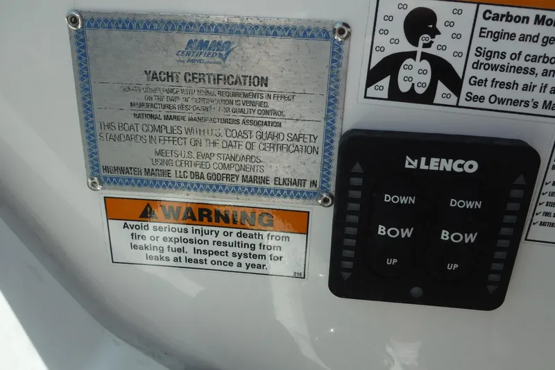 Slide: The Image of 2018 Hurricane SunDeck 2690 OB yacht certification and warning labels with Lenco control panel. - 17