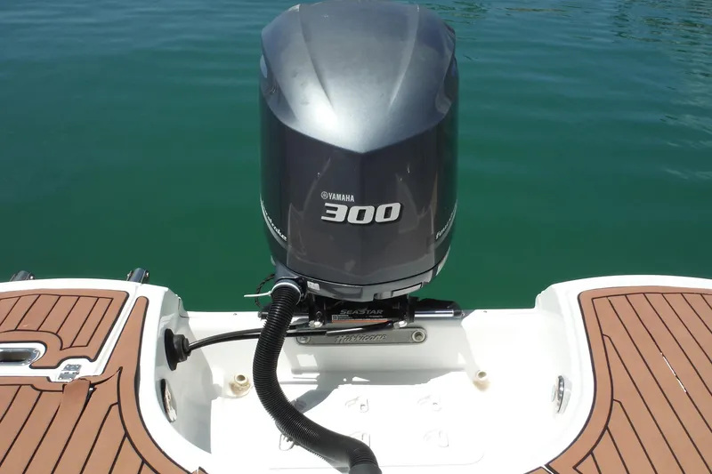 Slide: The Image of 2018 Hurricane SunDeck 2690 OB with Yamaha 300 outboard motor on calm water. - 22