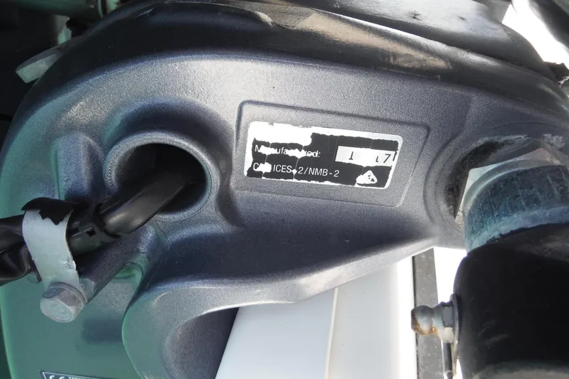 Slide: The Image of Close-up of a 2018 Hurricane SunDeck 2690 OB engine component with label details. - 26