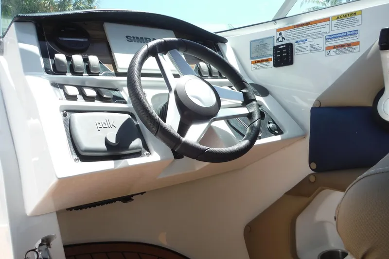 Slide: The Image of Steering console of 2018 Hurricane SunDeck 2690 OB boat with controls and gauges. - 28